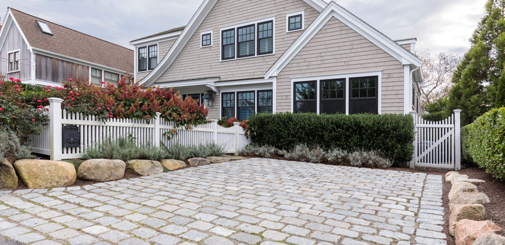 Front,View,Of,A,Large,House,That,Is,Secured.,It