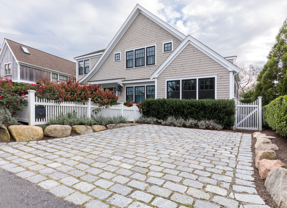 Front,View,Of,A,Large,House,That,Is,Secured.,It
